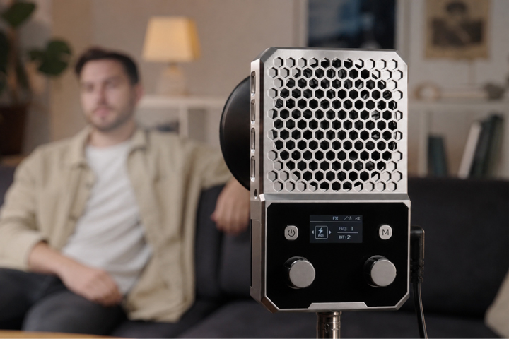 NEEWER FS60B compact 60W COB light on a stand in an indoor talking-head video setup